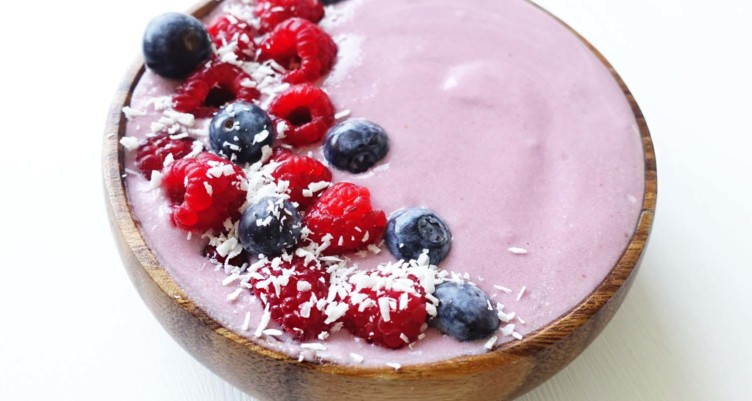 pink smoothie bowl with berry topping