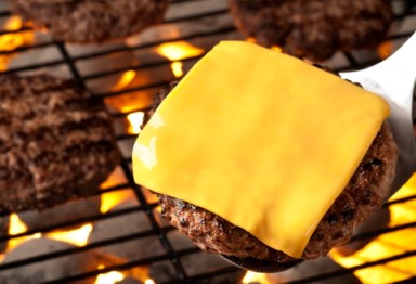 A cheeseburger on the grill